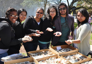 Geology students holding rocks
