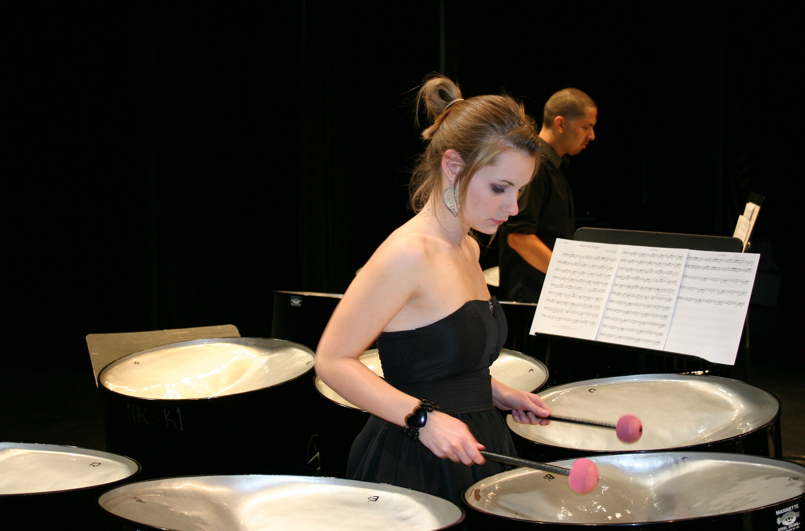 Student playing steel drums