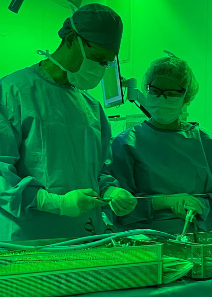 Picture of operating room with surgeon and surgical technician