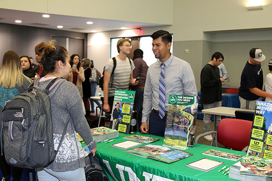 A student engages with a University of North Texas representative at a previous LSC-University Park college fair. This year's college fair is scheduled for Monday, Oct. 2.