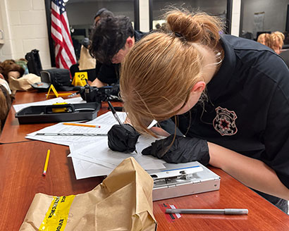 High school students log evidence sharpening their forensic skills during the Crime Scene Investigation challenge at a regional TXPSTA High School First Responders Competition in December. 