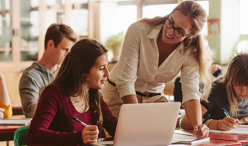 Student with teacher smiling