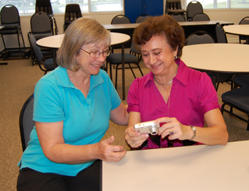 Consider giving the gift of education this holiday season with a continuing education class from Lone Star College-Montgomery, which offers a variety of special interest classes including digital photography. Pictured above from l. to r. are Ada Levins, a digital photography instructor, and Dulce Fulenwider, one of her students. 