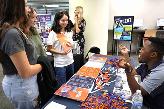 Students discuss college options with a University of Texas at San Antonio representative during a past LSC-University Park college fair. The 2023 Fall College Fair takes place Monday, Oct. 2.