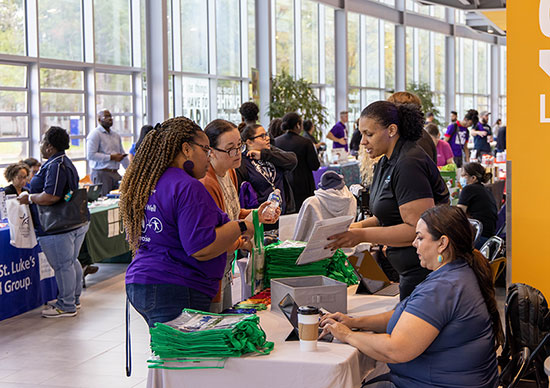 Faculty and staff engage with vendors during the 2022 Fit4Life Wellness Fair at Lone Star College-University Park. 