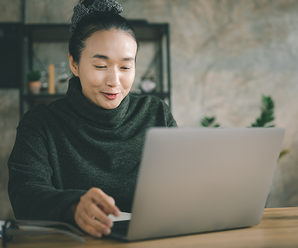 Person staring at a laptop.