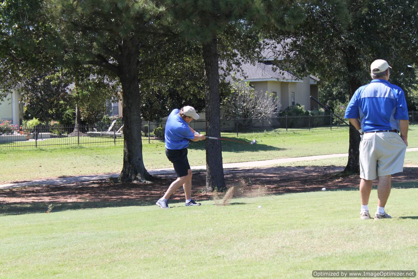 Photo of LSC employees playing golf