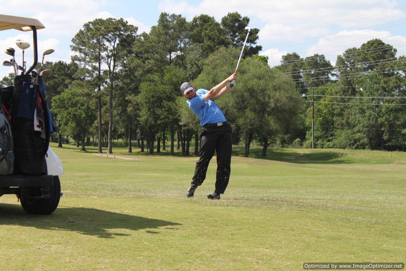 Photo of LSC employee playing golf