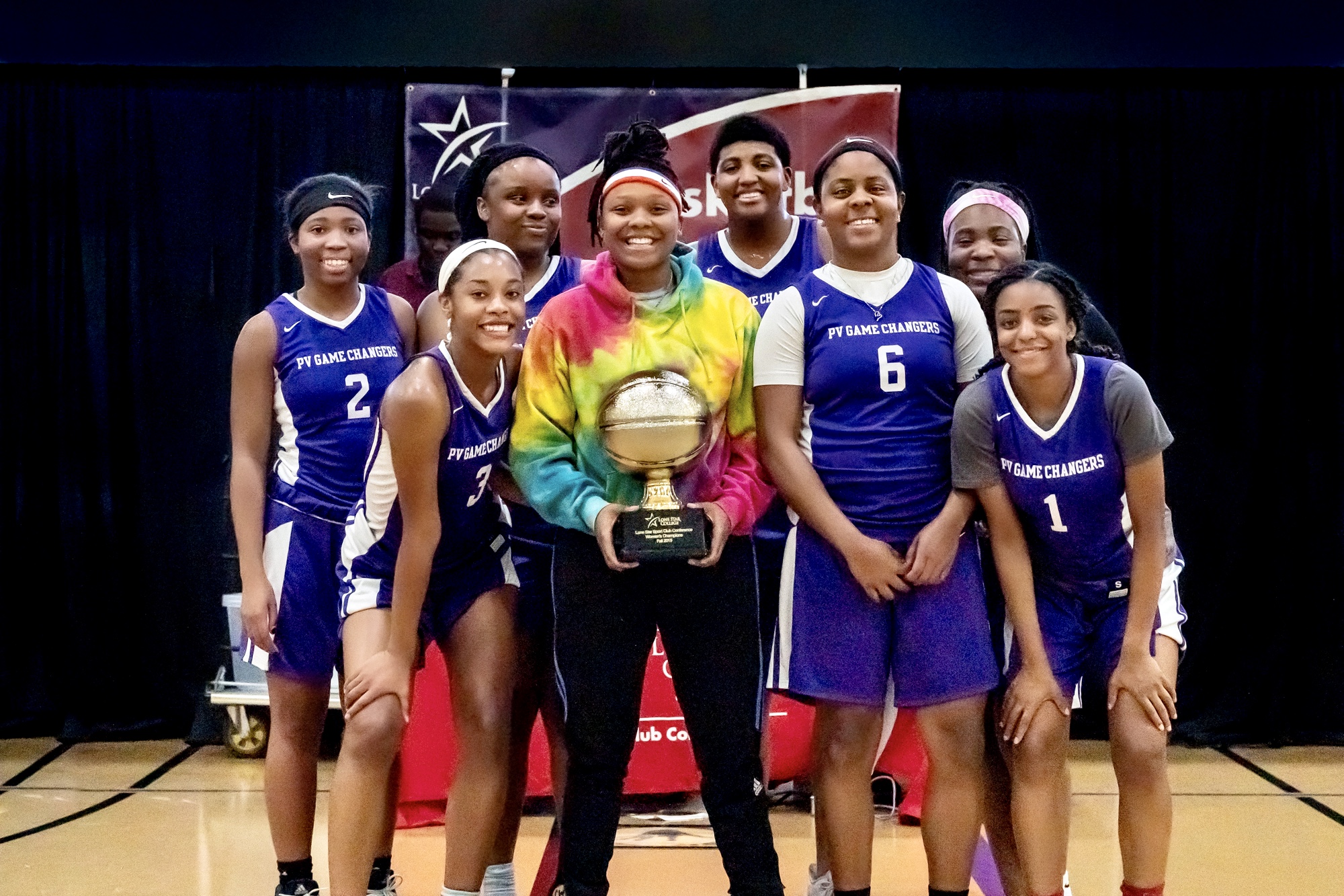 Team photo of students from Prairie View A&M University with a trophy