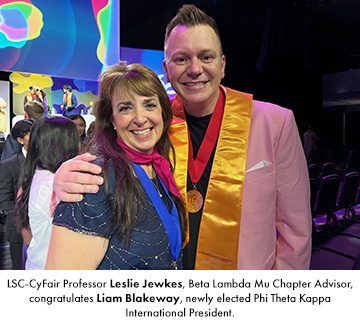 LSC-CyFair Professor Leslie Jewkes, Beta Lambda Mu Chapter Advisor, congratulates Liam Blakeway, newly elected Phi Theta Kappa International President.