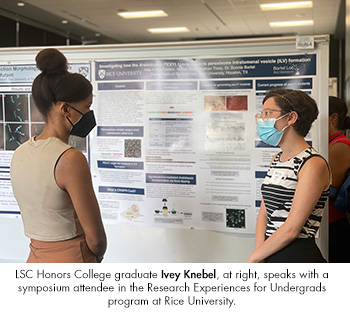 LSC Honors College graduate Ivey Knebel, at right, speaks with a symposium attendee in the Research Experiences for Undergrads program at Rice University. 