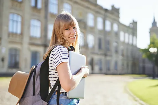 Happy student with backpack