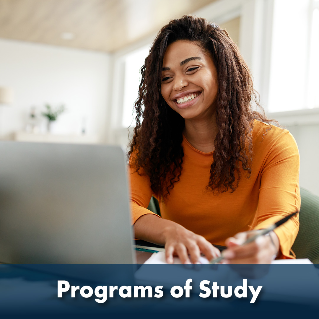 The words 'Programs of Study' are written across the bottom of the image as a header. Picture of an African-American college student smiling as she works on her laptop.