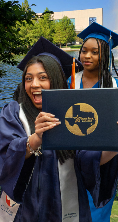 Two excited LSC-CyFair graduates standing on campus 