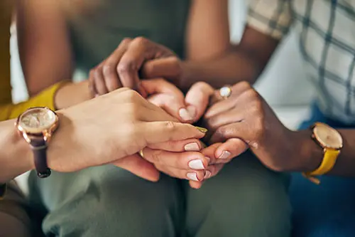 holding hands in a group