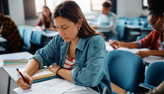 female student taking exam