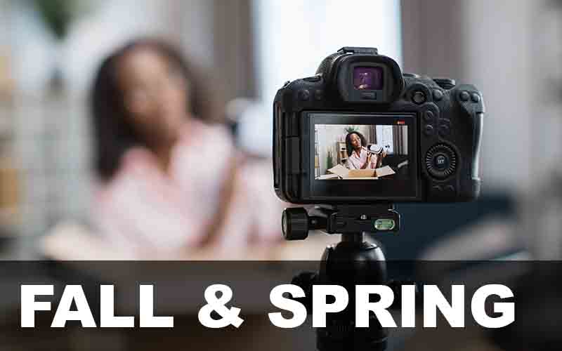 Woman recording a video of herself.