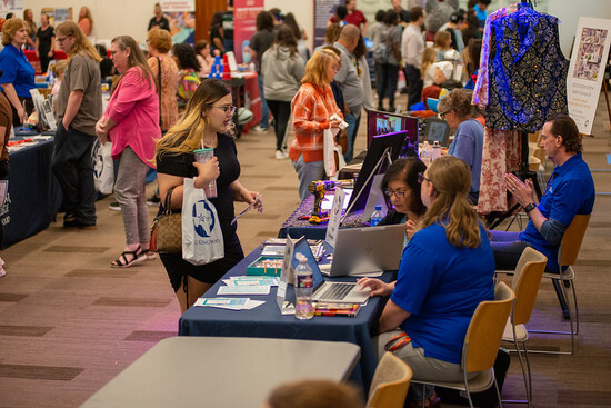 Photo of students and staff at an Open House