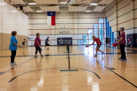 Photo of ALL members playing Pickleball