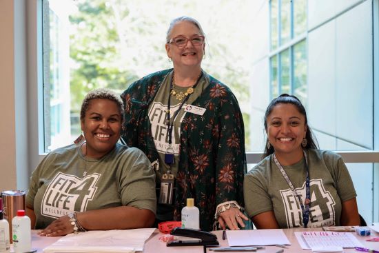 Fit4Life Staff Smiling and Greeting at Welcome Table