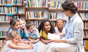 Small business owner reading to children in a bookstore.