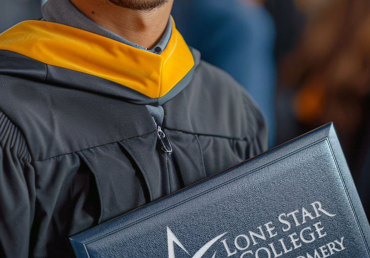 Student holding a diploma folder