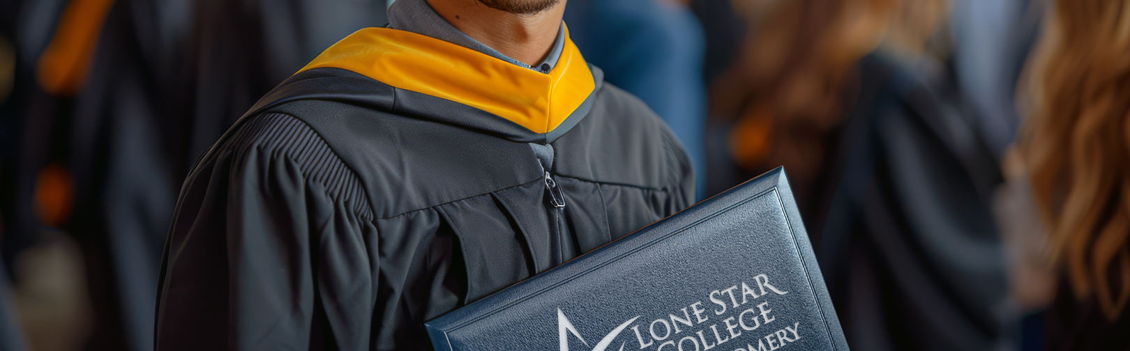 Student holding a diploma folder