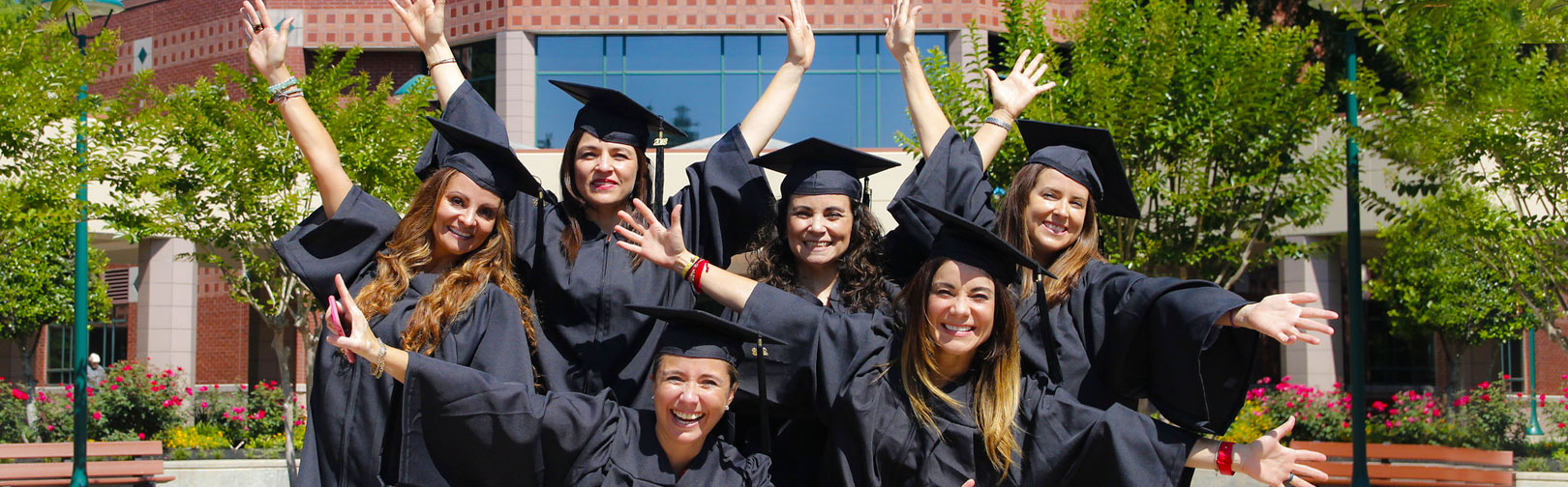 LSC graduates posing in front of LSC-Montgomery